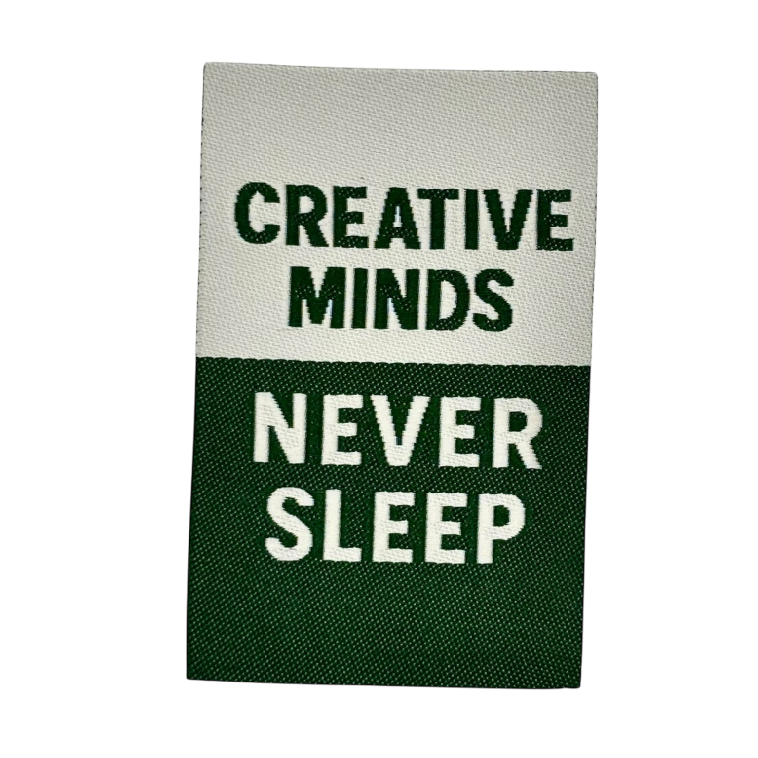 Geborduurd textiel met motiverende tekst Creative Minds Never Sleep in groen en wit